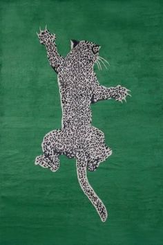 a drawing of a cat on a green background