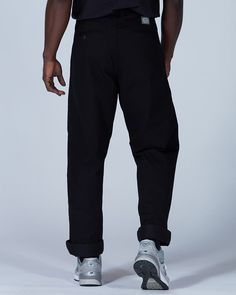 The Takibi Chino Pants are casual fire-resistant pants. The pants are made of cotton and modacrylic. The Takibi Chino Pants feature a button closure, dual side pockets, a coin pocket, and dual back pockets. The Takibi Chino Pants are designed to fit loose in the leg, with the hem hitting below the ankle. We recommend taking your normal size for a standard fit. The model stands 6' and wears size L.