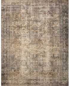 an antique rug with many different colors and patterns on the carpet, including beiges and browns