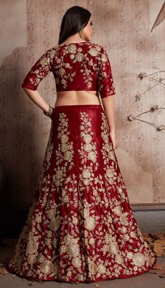 Semi Velvet Wedding Lehenga in Red and Maroon with Embroidered work Product Details: Fabric:Semi Velvet Work:Embroidered, Thread, Zari Color Family:Red and Maroon Occasion:Wedding Lehenga Dimension:530 Cm x 110 Cm ( L x W) Blouse Length:80 Cm Approx Washing Instruction:Dry Wash This is made to order product. We customize the pattern of the dress to suit your style and fitting. Once you place the order we will provide you with a template for measurements (to be taken in inches). It usually takes Semi-stitched Embroidered Choli For Traditional Ceremonies, Embroidered Semi-stitched Choli For Traditional Ceremonies, Floor-length Embroidered Art Silk Sets, Embroidered Sets For Wedding And Diwali, Red Saree Set With Floral Embroidery, Red Dola Silk Gown With Intricate Embroidery, Embroidered Dola Silk Sets For Wedding, Red Floral Embroidered Saree Set, Wedding Sets In Dola Silk With Embroidery