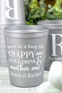 three cups with the words happy one and another one on them