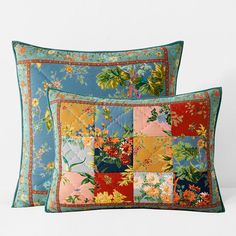 two pillows with colorful floral designs on them