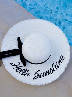 Top off your summer style with our Hello Sunshine Embroidered Straw Hat! This vacay essential effortlessly elevates your look and makes a sunny statement with its fun embroidery. Get ready to brighten up the day and turn heads wherever the horizon takes you! White Sun Hat, Fun Embroidery, Beige Top, Hello Sunshine, Dream Design, The Horizon, Straw Hat, Sun Hats, Summer Style