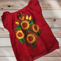 Handmade Embroidered Mexican Sunflower Blouse - Size Medium Large Handmade in Chiapas, Mexico Material: Manta (Natural Cotton) Size Medium Measurements (approximate): Length: 23 inches Armpit to Armpit: 19 inches Size Large Measurements (approximate): Length: 25 inches Armpit to Armpit: 21 inches Size: XL Measurements (approximate): Length: 24 inches Armpit to Armpit: 24 Care Instructions: We recommend hand washing in cold water with like colors & air drying. A warm iron can be used if needed. Our blouses are handmade and may have slight imperfections that make them unique & one of a kind. Please check out the photos & feel free to send us a message if you have any questions. Spring Cotton Blouse With Motif, Spring Folk Tops With Machine Embroidery, Spring Folk Style Tops With Machine Embroidery, Folk Style Spring Tops With Machine Embroidery, Summer Embroidered Top With Motif, Yellow Folk Top With Floral Embroidery, Yellow Floral Embroidered Folk Top, Summer Folk Style Embroidered Top, Yellow Folk Style Top With Floral Embroidery