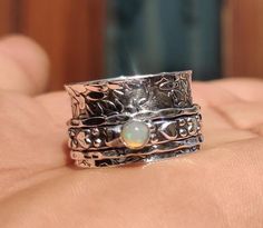 Opal Ring, Spinner Ring, 925 Sterling Silver, Handmade Ring, Statement Ring, Opal Jewelry, Fidget Ring, Women Ring, Gift For Her=======================================================================================================Benefits Of Opal Stone**It is said to bring stability to a troubled marriage and improve social relations of a person overall. Medically, Opal stone is said to benefit the Endocrine System and maintain the balance of hormonal secretions. Opal stone is believed to impro Silver Stackable Opal Promise Ring, Silver Adjustable Opal Ring, Silver Adjustable Opal Ring With Round Band, Silver Opal Ring With Adjustable Band, Silver Stackable Opal Ring As Gift, Silver Opal Stackable Ring For Anniversary, Silver Stackable Opal Ring For Anniversary, Stackable Silver Opal Ring As Gift, Anniversary Silver Stackable Opal Ring