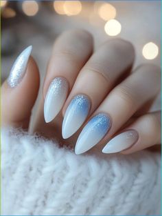 White Christmas nails: the perfect way to add a touch of frosty elegance to your holiday style. Explore 25 stunning designs that capture the essence of winter beauty. From shimmering snowflakes to pearlescent finishes, these nail ideas will elevate your festive look and keep you feeling glamorous throughout the season. White Blue Silver Nails, Winter Gel X Nail Designs, White Ombre Christmas Nails, Frosty Christmas Nails, Blue And White Ombré Nails, Winter Ombre Nails Ideas, Nail Snowflake Design, Ombre Snowflake Nails, Xmas Nails White