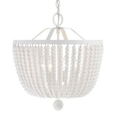 a white chandelier with beads hanging from the ceiling