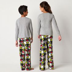 Your big kids will look adorable this festive season thanks to this Grinch themed unisex 2-piece pajama set. Made from soft jersey, it includes a long-sleeve graphic top and coordinating pair of checked printed pajama pants with an elastic-waist. Get matching sets for the whole family. # Pieces In Set: 21st Piece Description: Top1st Piece Fabric: Jersey1st Piece Fiber Content: 100% Polyester1st Piece Care: Machine Wash, Tumble Dry2nd Piece Description: Pants2nd Piece Closure Type: Full Elastic2… Playful Christmas Loungewear Set, Matching Christmas Bedtime Sets, Holiday Matching Long Sleeve Sets, Matching Winter Pajama Party Sets, Matching Winter Sets For Pajama Party, Matching Sets For Pajama Party In Winter, Playful Long Sleeve Festive Sleepwear, Matching Christmas Sleepover Sets, Winter Multicolor Loungewear Sets