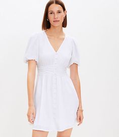 This flouncy, fluid woven dress is flawlessly framed with pretty puff sleeves and a flattering defined waist. V-neck. Button front. Short sleeves with elasticized cuffs. Elasticized back waist.,Imported:Imported,Fit:Fit: Waisted - fits and flatters waist,Length:32 1/2" from shoulder to hem, measured from a size 8/M,Fabrication:Shell: 79% Rayon 21% Linen, Lining: 100% Rayon Exclusive of elastic,Garment Care:Machine Washable Loft Button V-Neck Mini Dress Size 4 White Women's by Loft Size Regular - 4 White Women's Fit, &, Flare, V-Neck, Short, Sleeve, DRESSES, Shell:, 79%, Rayon, 21%, Linen, Lining:, 100%, Rayon, Exclusive, of, elastic, Machine, Washable White Dress With Sleeves, Tall Dresses, Exclusive Clothing, Sleeve Dresses, Size 16 Dresses, Woven Dress, Dress With Cardigan, Petite Dresses, Grey Fashion