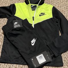 Nike Jogging Suit Sporty Winter Sports Sets, Nike Sets For Winter Playwear, Sporty Nike Winter Sets, Nike Sporty Winter Sets, Nike Long Sleeve Sets For Winter, Nike Long Sleeve Winter Sets, Sporty Black Streetwear Sets, Sporty Black Sets For Streetwear, Spring Sports Sets Sportswear