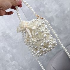 Size:13*12cm Note: Manual measurement, please allow 1-3CM error. Trendy Crossbody Phone Bag For Party, Summer Event Pouch Bags, Summer Party Shoulder Bag With Pearl Handle, White Rectangular Phone Bag For Party, Beaded Rectangular Phone Bag For Parties, Rectangular Beaded Phone Bag For Parties, Party Beaded Rectangular Phone Bag, Party Bucket Bag For Mobile Phone, Party Rectangular Beaded Phone Bag