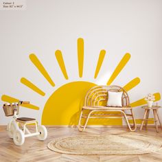 the sun is painted on the wall in this children's room with yellow accents