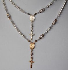 "This Catholic Rosary Necklace is stunning...and it is complete with all five decades of the Holy Rosary. This necklace can be blessed as a sacramental. A beautiful gift for Birthday, Wedding, Communion or Confirmation, Mother's Day, Sympathy/Courage...or any special expression of love. I created this Rosary necklace using 4mm Swarovski crystal white pearls for the Ave's, and 6mm white pearls for the Pater's. Surrounding the Pater's are gold 4mm crystal or AB crystal rondelles and 3mm crystal bi Spiritual Crucifix Jewelry For Wedding, Silver Necklace With Miraculous Medal For Wedding, Elegant Miraculous Medal Jewelry For Gift, Elegant Miraculous Medal Jewelry Gift, Spiritual Wedding Miraculous Medal Jewelry, White Spiritual Jewelry For Celebration, Spiritual White Necklace For Anniversary, Spiritual White Necklaces For Anniversary, Rose Gold Crucifix Necklaces For Anniversaries