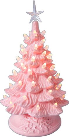 a pink ceramic christmas tree with white lights