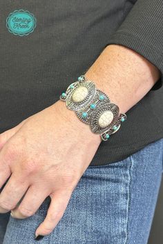 This one-of-a-kind silver bracelet is a real gem! Featuring unique turquoise and white stones, it's sure to add a sparkle to any outfit. So slip it on and show the world your fashionable flair!  width: 1.25  Dont forget to add the matching necklace and earrings! (sold separately) Trendy Silver Jewelry With Gemstones, Trendy Silver Gemstone Jewelry, Southwestern Style Adjustable Bracelets, Unique Adjustable White Jewelry, Bohemian White Bangle Jewelry, Nickel-free Turquoise Bracelet Jewelry, White Sterling Silver Bohemian Bracelets, White Bohemian Sterling Silver Bracelets, Bohemian White Sterling Silver Bracelets