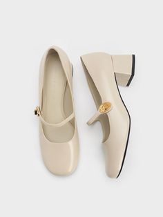 Timeless and elegant, this pair of Mary Janes features a rounded square-toed silhouette and a glossy white finish for a polished, effortlessly stylish look that is suitable for most occasions. Other eye-catching details include the brass turn-lock accents on the delicate straps and block heels for a sturdy stature boost. Timeless Shoes, Classy Shoes, London Shoes, Chic Shoes, Faux Leather Heels, Shoe Inspo, Aesthetic Shoes, Charles Keith, Mary Jane Heels