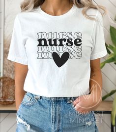 Boho Nurse Heart Shirt, TShirt for Registered Nurse, RN Nurse T-shirt, Gift For Nurse, Nurse Graphic Shirt, Nursing School, Nurse Life Shirt Bella Canvas 3001T:  T-Shirt Sizing Please reference the size chart before selecting shirt size.  Use one of your own t-shirts to measure the size and fit.  Then compare with the size chart provided to ensure an accurate fit. T-Shirt Materials 100% combed and ring-spun cotton. Heather colors are 90% combed and ring-spun cotton, 10% polyester. Pre-shrunk fab Relaxed Fit Short Sleeve Top With Heart Graphic, Heart Graphic T-shirt With Relaxed Fit And Short Sleeves, Short Sleeve Graphic Tee With Heart Graphic, Heart Graphic Short Sleeve Graphic Tee, Heart Graphic Crew Neck T-shirt, Short Sleeve Tops With Heart Graphic, Short Sleeve T-shirt With Heart Graphic, Cotton T-shirt With Heart Graphic, Short Sleeve, Short Sleeve Cotton T-shirt With Heart Graphic