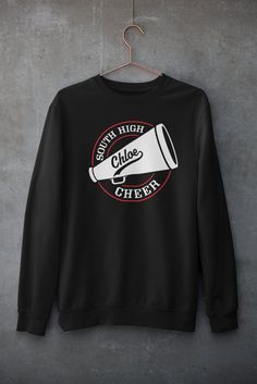 Personalized Cheer Shirt. This design can be customized with your text, team/school name and colors. Ask about group pricing! See Size Charts in the photos for sizing. Printed on a Black Heavyweight Crew Neck Sweatshirt Features: 8 oz./yd² (US) 13.3 oz./L yd (CA), 50/50 cotton/polyester, 20 singles Heather Sport colors: 60/40 polyester/cotton 2-end midweight fleece fabric Classic fit Air jet yarn for softer feel and reduced pilling Double-needle stitching at shoulders, armholes, neck, waistband Cheer Tshirt Ideas, Senior Cheer Shirts, Cheer Sweatshirts Design, Cheer Shirts Designs, Cheer T Shirts, Cheer Tshirt Designs, Cheer Merch, Cute Cheer Shirts, Cheer Designs