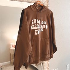 Just Go With The Flow Brown Hoodie Sweatshirt Unisex Sizing. Handmade By Me! Oversized Brown Hoodie With Letter Print, Brown Graphic Print Hoodie With Long Sleeves, Brown Long Sleeve Hoodie With Graphic Print, Brown Letter Print Hoodie Sweatshirt, Graphic Print Hoodie For Fall, Brown Hoodie Sweatshirt With Letter Print, Brown Crew Neck Hoodie With Letter Print, Brown Graphic Print Hoodie Sweatshirt, Brown Letter Print Hooded Top