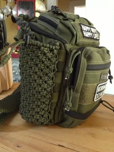 a green bag sitting on top of a wooden table