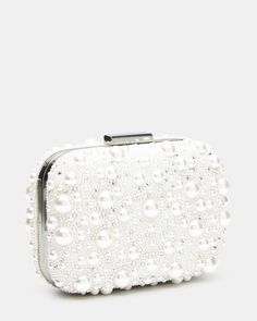 Functional and elegant, the SYREN bag adds a touch of sophistication to any outfit. Adorned with pearls and a delicate chain strap, this crossbody bag doubles as a glamorous clutch with a secure snap closure. Perfect for any occasion, elevate your style with this versatile accessory. Embellished pearl crossbody bag Chain crossbody strap Peal and rhinestone embellishments Crossbody strap: 20 inches 4.25in H x 6.25in W x 2.25in D Synthetic materials Duster bag included Imported Rhinestone Embellishments, Bag Chain, Synthetic Materials, Delicate Chain, Crossbody Strap, Chain Strap, Snap Closure, Clutches, Embellishments