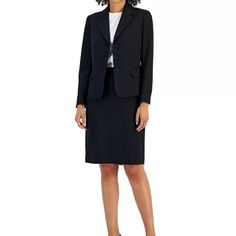 Elevate Your Workwear Game With This Women's Skirt Suit From Le Suit, Ensuring You'll Command The Boardroom With Confidence And Leave A Lasting Impression. Pair With Your Favorite Cami & Heels As It Transitions Seamlessly To Evening Wear. Career Capsule Wardrobe. Jacket Has A Notched Collar With Three Button Closure. Sleeves Are Notched At Wrist. Front Welted Pockets. Padded Shoulders. Lined Skirt Has A Pencil Silhouette With Hook And Zipper Closure At Back. Back Flap. Lined. 100% Polyester Waff Classic Black Business Skirt Suit, Classic Black Skirt Suit For Business, Black Notch Lapel Skirt Suit For Business, Fitted Black Skirt Suit For Business, Tailored Black Skirt Suit For Business, Black Notch Lapel Skirt Suit For Office, Black Notch Lapel Skirt Suit For Work, Black Skirt Suit With Notch Lapel For Work, Black Office Lady Skirt Suit For Business