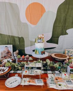 a table topped with lots of cakes and desserts