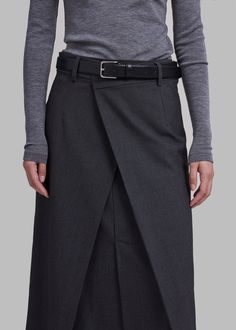 Color: Charcoal Heavyweight woven fabric Relaxed fit Midi length Double layered at front High front slit Asymmetrical hemline Back illusion welt pocket Belt loops Side seam zip closure Hook and bar closure 63% Polyester 27% Rayon 10% Wool Dry Clean By The Frankie Shop. Imported Ralph Lauren Looks, Ropa Upcycling, Trendy Mom Outfits, Long Wrap Skirt, Midi Wrap Skirt, Diy Clothes And Shoes, The Frankie Shop, Frankie Shop, Trendy Fall Outfits