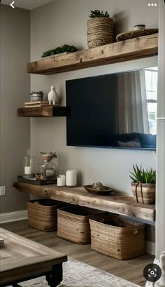 a flat screen tv mounted to the side of a wooden shelf in a living room