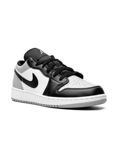 Jordan 1 Low sneakers from Jordan Kids featuring black, white, leather, signature Swoosh logo detail, signature Air Jordan Wings logo, contrasting panel detail, round toe, front lace-up fastening, branded insole and rubber sole. These styles are supplied by a premium sneaker marketplace. Stocking only the most sought-after footwear, they source and curate some of the most hard to find sneakers from around the world.. | Jordan Kids Jordan 1 Low sneakers Jordan 1 Low Shadow, Black Jordans, Jordan 1 Low, Air Jordan 1 Low, Kids Jordans, Low Sneakers, Flat Boots, Ballet Flat Shoes, Nike Air Force Sneaker