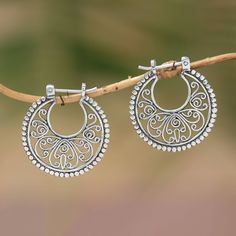 Add an enchanting accent to your look with this beautiful pair of hoop earrings. Inspired by traditional Balinese openwork artisan Rupadana handcrafts each earring from sterling silver with gorgeous swirling bun motifs accented with petite jawan silver dots for a lovely feminine design. Dad Jewelry, Filigree Jewelry, Jewelry Workshop, Ancient Jewelry, Sterling Silver Hoop Earrings, Feminine Design, Coat Women, Lovely Earrings, Sterling Silver Hoops