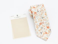 "GOLDMTLC Floral Wedding Tie, Men's Ties, Vintage Men's Tie, Champagne Flower Bow Tie, Groomsmen Tie, Ivory Dress Tie, Pocket Square Tie GOLDMTLC floral wedding tie is one of our most favorite groomsmen ties chosen to outfit wedding party. The fine fabric on this necktie gives off the great shine and looks great at any formal or informal gatherings. Even though this goldmtlc men's tie is so popular for weddings, it is still an ideal choice for business attire. Great design and texture tie gives Wedding Dress Tie, Tie Wedding Dress, Floral Wedding Tie, Bow Tie Groomsmen, Groomsmen Tie, Champagne Tie, Peach Tie, Champagne Flowers, Groomsmen Ties