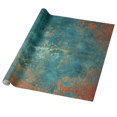 an old, rusted metal surface with blue and orange paint on it wrapping paper