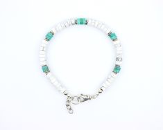 This bracelet is handmade with high quality AAA grade genuine white buffalo howlite & blue green 6mm Kingman Arizona turquoise heishi beads, from the Kingman Turquoise mine in Arizona, USA. This is a gorgeous streamlined minimalist bracelet that you have to handle and wear to appreciate! Wear it stacked with other bracelets or simply by itself. It will quickly become your simple go-to everyday bracelet. These stones are beautiful shades of blueish green, have a superior polish, are perfectly cal White Howlite Bohemian Bracelets, White Howlite Bracelets With Natural Stones, White Howlite Bohemian Bracelet, White Bohemian Howlite Bracelet, Kingman Arizona, Heishi Bracelet, Blueish Green, Everyday Bracelet, Arizona Turquoise