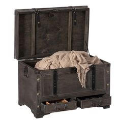 an open trunk with two drawers and a blanket