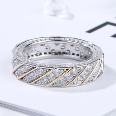 a diamond ring sitting on top of a table