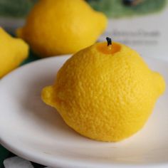 A small white plate with lemons that are blurred in the background. On the plate is a candle with the appearance of a lemon, and a slightly burnt wick. Lemon Candles, Faux Food, Lemon Candle, One Candle, Puzzles Gifts, Beautiful Candles, Good Enough, Candle Set, Etsy Candles