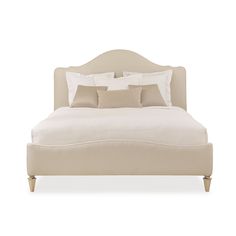 a bed with white sheets and pillows on it's headboard, in front of a white background