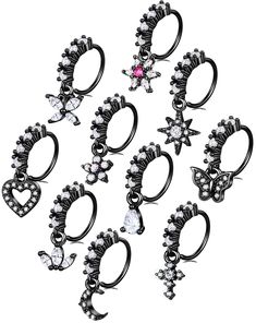 six pairs of rings with different designs and colors are shown in the image, including one pink