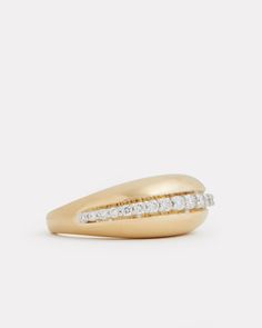 a yellow gold ring with two rows of diamonds on the top and bottom, set against a white background