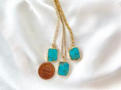 **Each piece in my shop, I personally create and photograph. (All photos are property of The Cord Gallery LLC) Thank you for supporting my small business.Rectangle Turquoise Pendant Necklace Turquoise never goes out of style and these Turquoise Pendant Necklaces are a great way to add a pop of color to any outfit. Features genuine Turquoise, rectangle cut and framed in gold electroplating. Hangs on your choice of chain.Pendants measure 10mm x 12mm. Each gemstone will be chosen at random to creat Rectangular Turquoise Gemstone Necklaces, Rectangular Turquoise Gemstone Necklace, Turquoise Square Pendant Necklace For Jewelry Making, Turquoise Square Pendant Necklace As Gift, Rectangular Blue Turquoise Necklace For Gifting, Turquoise Necklace With Square Pendant As Gift, Blue Rectangular Turquoise Necklace Gift, Turquoise Rectangular Natural Stones Necklace, Turquoise Rectangular Pendant Necklace As Gift