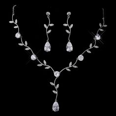 a necklace and earring set with leaves on the side, in white gold plated