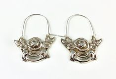 "These earrings are made from a vintage silver dish which had a beautiful embossed around the edge of flowers and other art nouveau motifs. I followed the line of the pattern into a point, drilled it and attached a sterling silver ear wire which is attached to either side of the charm. One side is hooked and unloops from the other side for you to insert the ear wire, and then clip it back up. They are very lightweight but are so eye catching. Measurements: Charm Length: 53 mm / 2.08\" Charm Widt Vintage Silver Jewelry With Lever Back Ear Wires, Vintage Nickel-free Small Hoop Earrings, Vintage Silver Hoop Earrings For Wedding, Vintage Sterling Silver Hoop Earrings With Ear Wire, Vintage Nickel-free Hoop Earrings, Vintage Hoop Earrings With Ear Wire, Vintage Hoop Earrings For Gift, Vintage Round Hoop Earrings With Ear Wire, Vintage Small Hoop Silver Jewelry