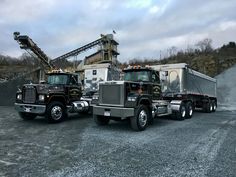 two large trucks parked next to each other