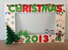 a christmas photo frame is decorated with decorations