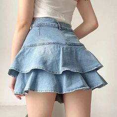 This mini skirt is a delightful play on the classic denim look, featuring tiered ruffles that add a flirty twist to the traditional silhouette. Its charming design is accentuated by the subtle hint of playfulness, making it an adorable choice for anyone looking to add a whimsical touch to their casual attire. Denim material Button & zip fastening Belt loop details Double pockets at front High waisted Polyester Vintage Denim Skirt, Cake Skirt, Crop Pullover, High Waisted Denim Skirt, Skirt Denim, Corset Bustier, Skirt Shorts, Dress Cake, Skirt Midi