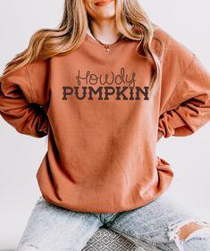 Howdy Pumpkin sweatshirt See the t-shirt here: https://thistleandmain.etsy.com/listing/1779232370 Comfort Colors 1466 sweatshirt is made with soft, ring-spun cotton fabric with 100% cotton threads, it sits unmatched when it comes to softness. All sweatshirts feature a rolled forward shoulder and are printed with OEKO-TEX-certified low-impact dyes. Lastly, Comfort Colors is a proud member of the US Cotton Trust Protocol which means sustainable cotton sourcing that's good for the environment.  -100% ring-spun cotton -Light fabric (6.4 oz/yd² (217 g/m -Relaxed fit -Sewn-in twill label Howdy Pumpkin, Farm Fresh Pumpkins, Pumpkin Sweatshirt, Pumpkin Sweatshirts, Pumpkin Picking, Comfort Colors Sweatshirt, Burnt Orange Color, Laid Back Style, Farm Fresh