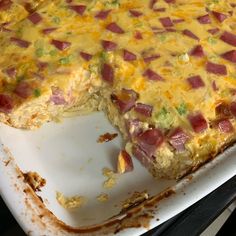 a casserole dish with ham and cheese on it