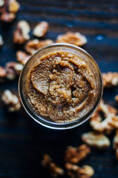 a jar filled with nuts on top of a table