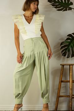 Elegant and unforgettable, Paola is the perfect pant to add to your closet. With an elastic back, pleated legs and a citrine color, she's the perfect bit of color and style to add to your summer wardrobe. Finish the LookPair with a cropped or short blouse or a blouse that looks good tucked in to a high waisted pant. Perfect to pair with a solid staple top or punch it up with a bold color Style FeaturesElastic backFront PleatsPocketsButton closure at ankle Size + Fit9Model is 5`9" And Wearing Siz Short Blouse, Staple Tops, Short Blouses, Perfect Pant, Pants Large, Pleated Pants, Bold Color, Color Style, High Waisted Pants